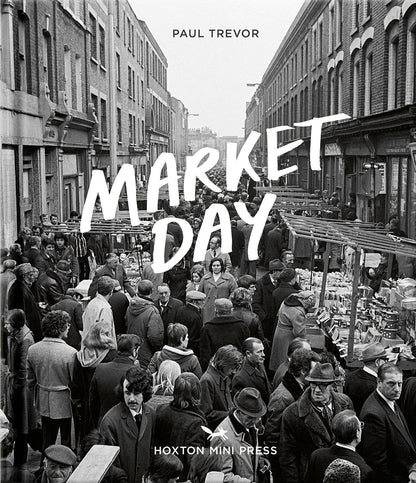 Book cover of 'Market Day' by Paul Trevor with a black and white photo of a market scene.