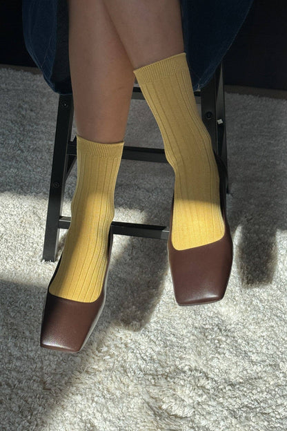 Her Socks in Buttercup